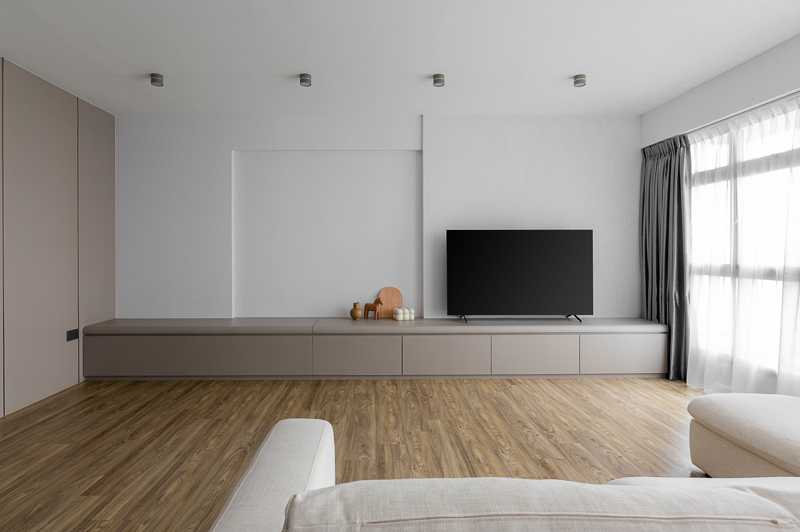 Scandinavian Living Room with Homogeneous Tiles and Feature Wall