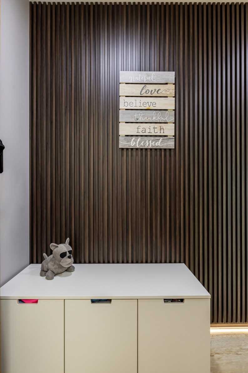 Minimalist Entryway with Feature Wall and Small Storage