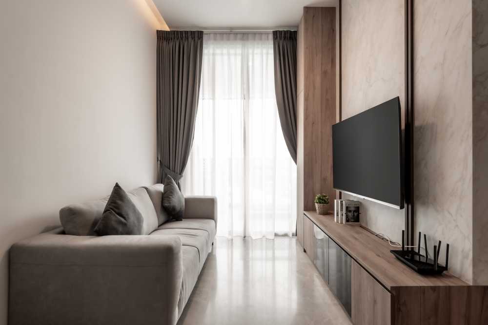 Contemporary Living Room with Homogeneous Tiles and Display Cabinets