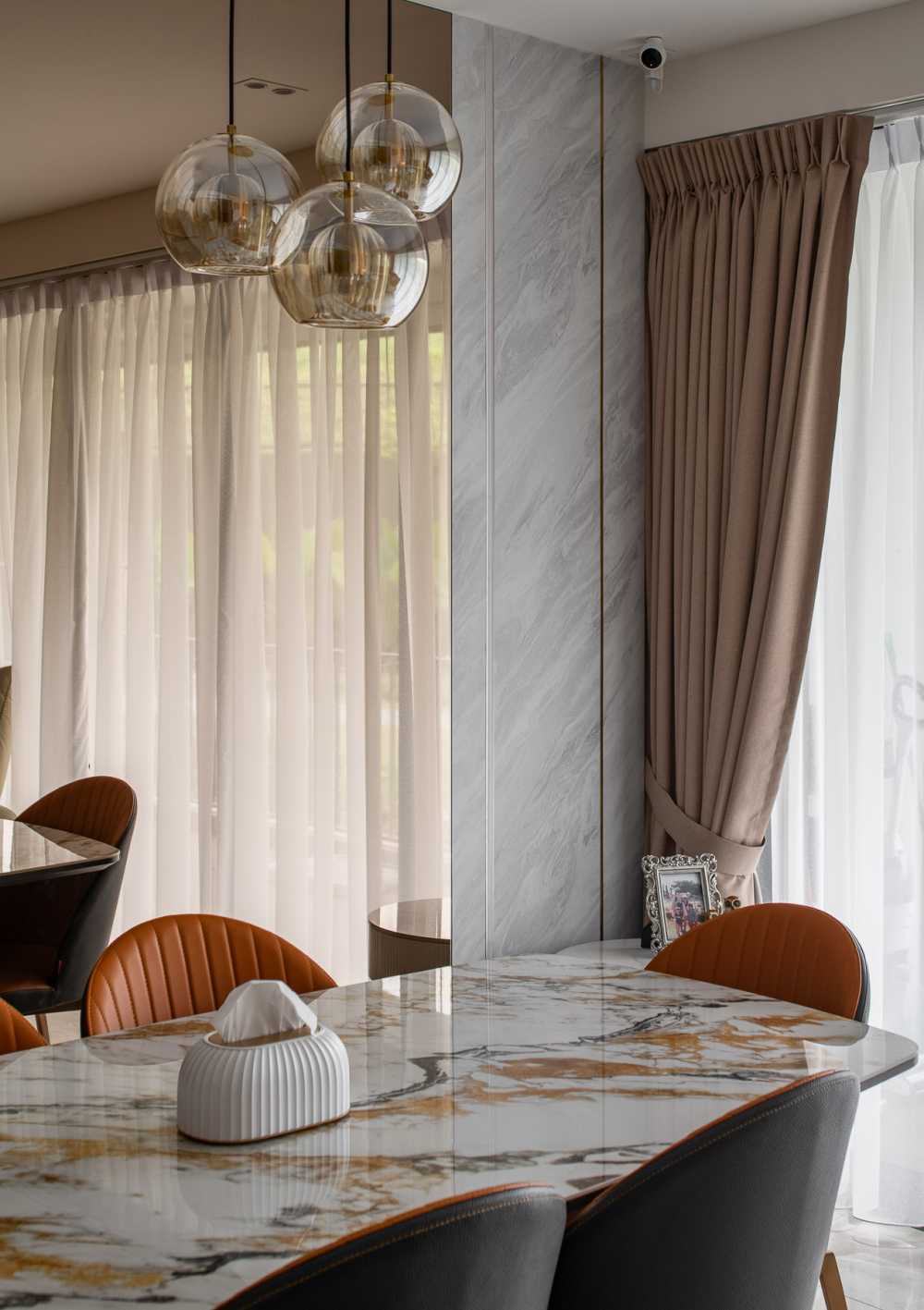 Contemporary Dining Room with Chandelier and Dining Chairs