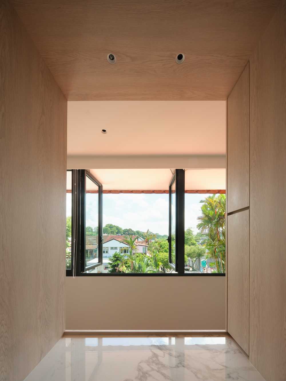 Minimalist Bedroom with Wood Flooring and Ceiling Light