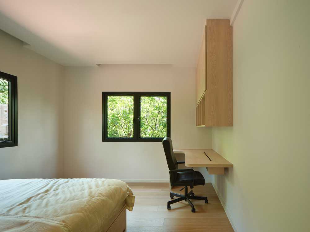 Minimalist Bedroom with Wood Flooring and Queen Bed