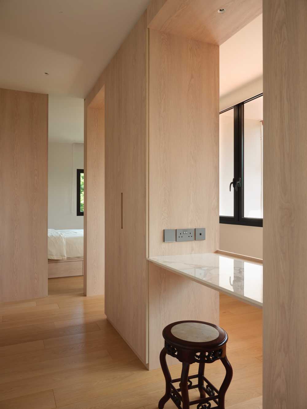 Minimalist Bedroom with Wood Flooring and Cove Lighting
