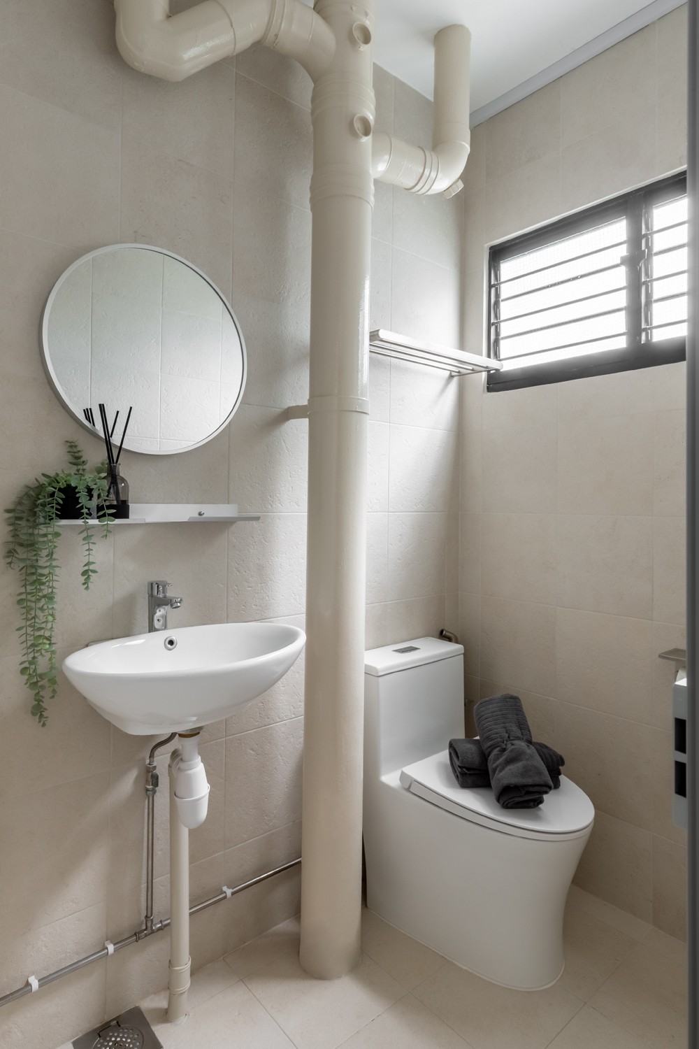 Asian Bathroom with Homogeneous Tiles and Mirror
