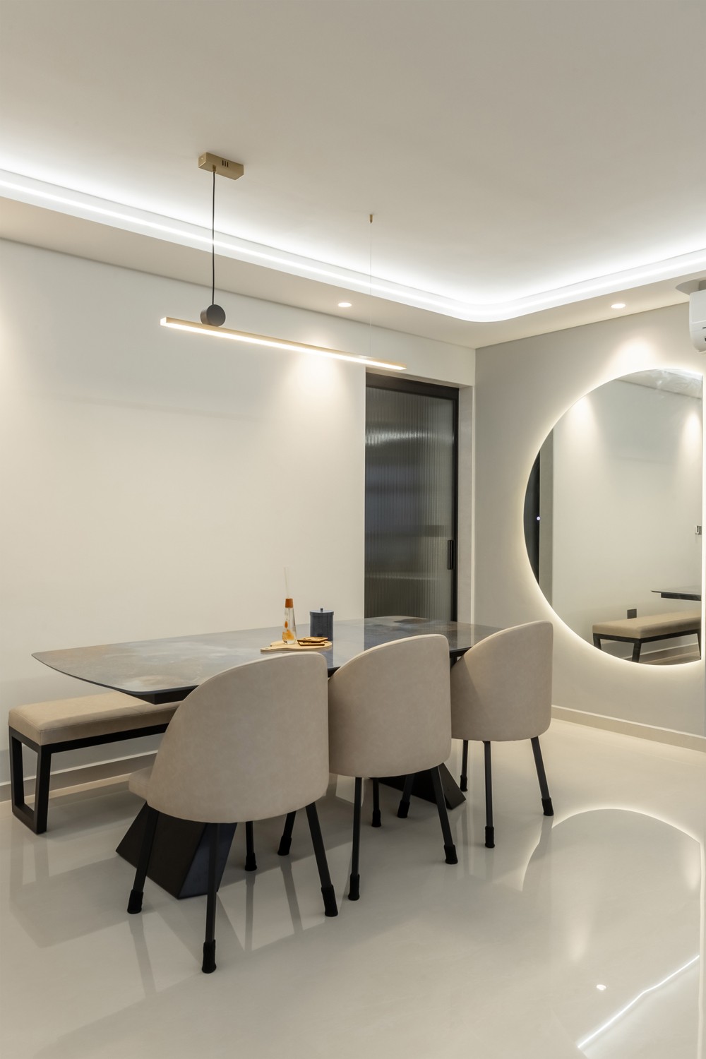 Contemporary Dining Room with Mirror and Cove Lighting