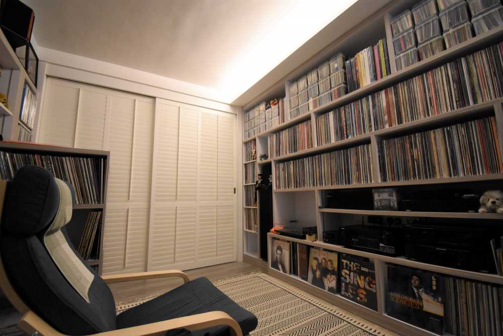 Vintage Home Theatre with Bookshelf and Cove Lighting