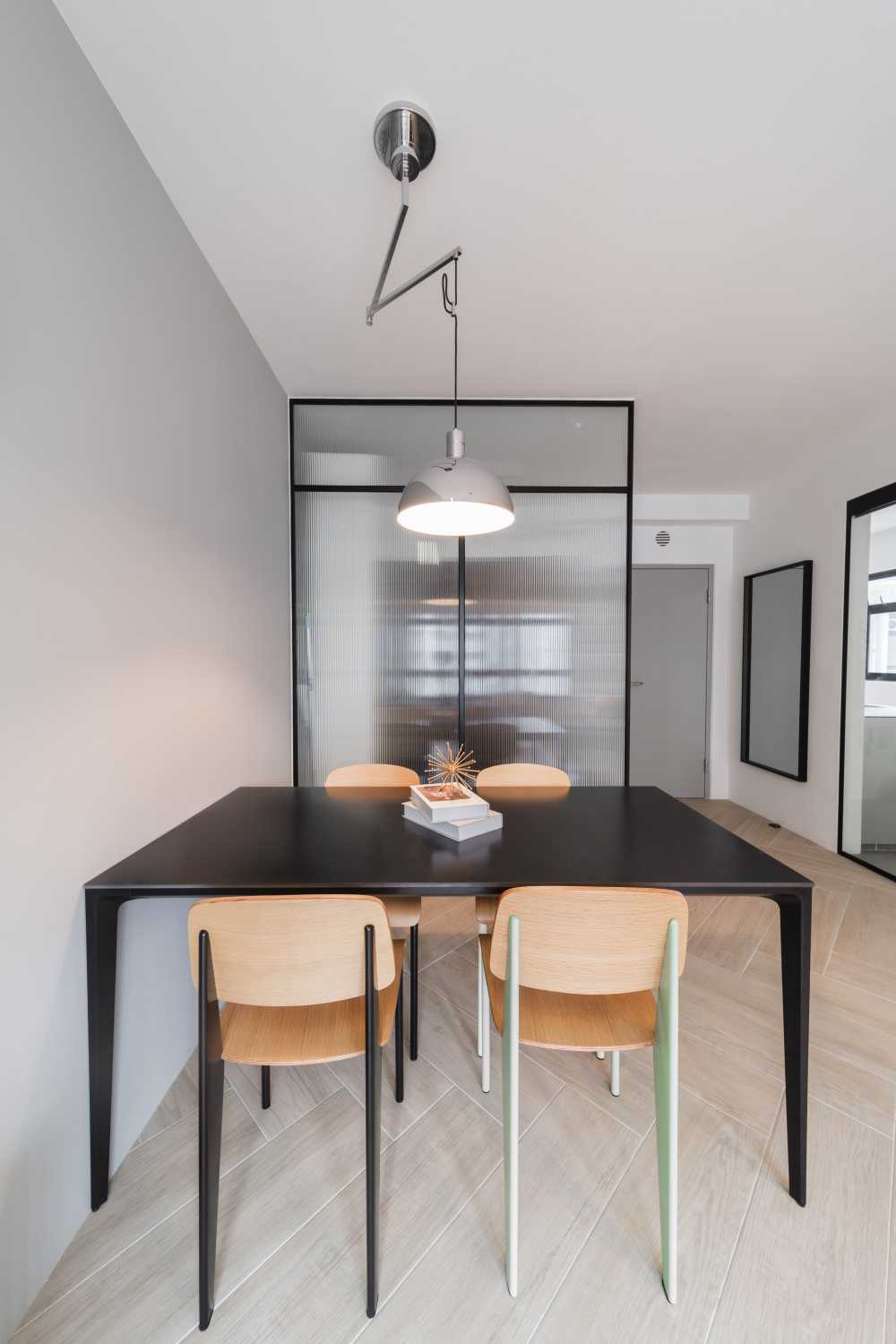 Contemporary Dining Room with Drop Light and Dining Table