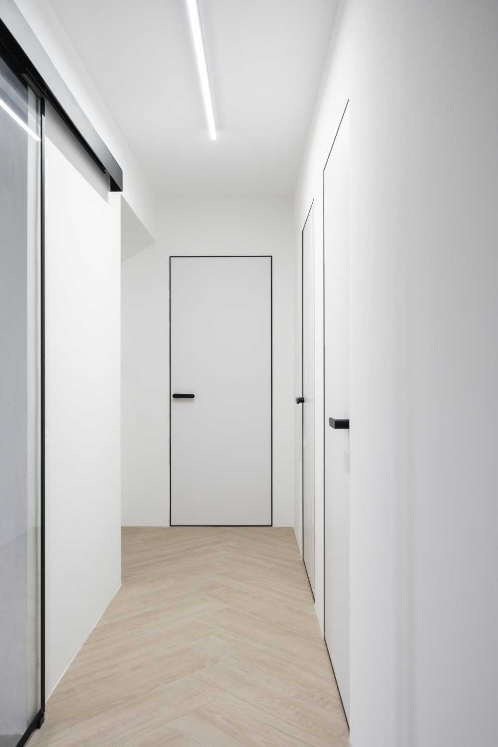 Contemporary Hallway with Artwork and Ceiling Light