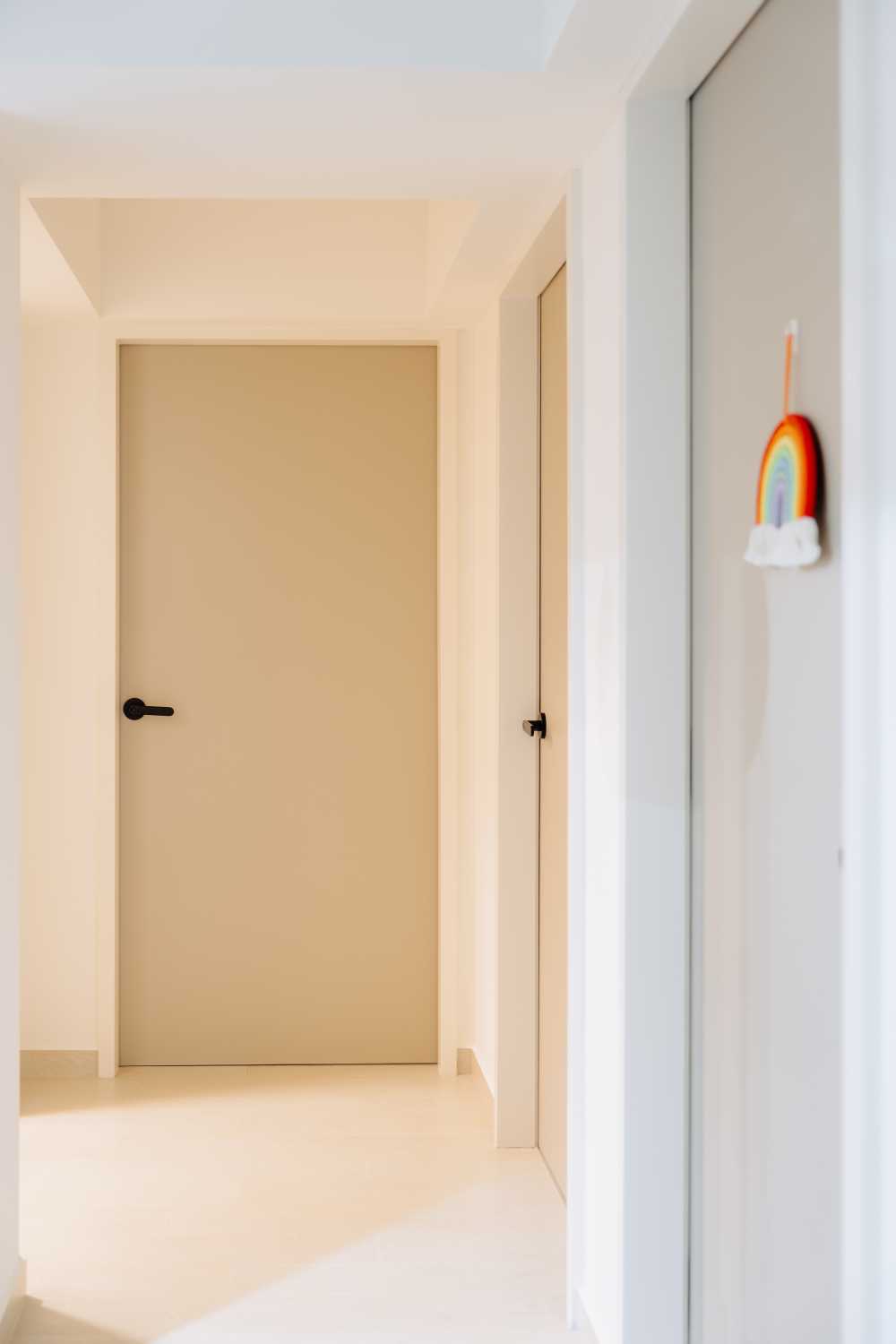 Modern Hallway with Paintings and Doors