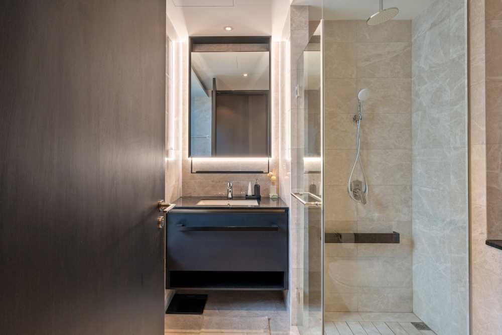 Contemporary Bathroom with Granite Floor and Mosaic