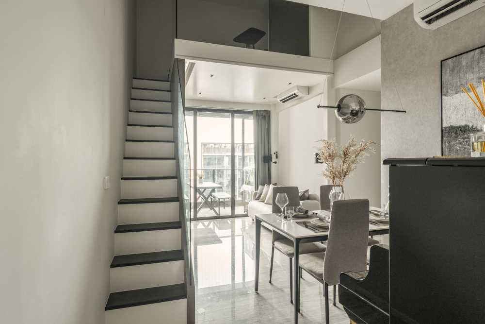Contemporary Living Room with Cement Floor and Feature Wall
