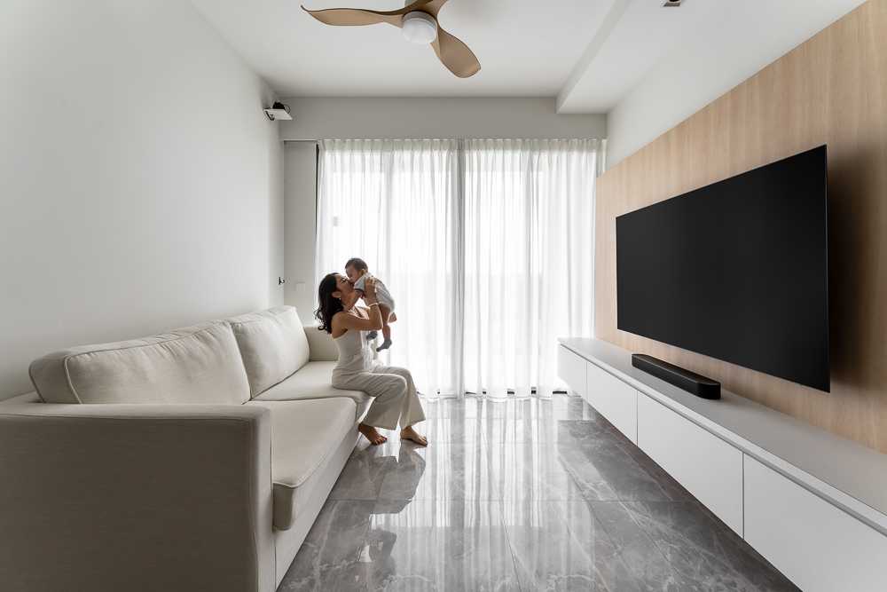 Scandinavian Living Room with Homogeneous Tiles and TV Console