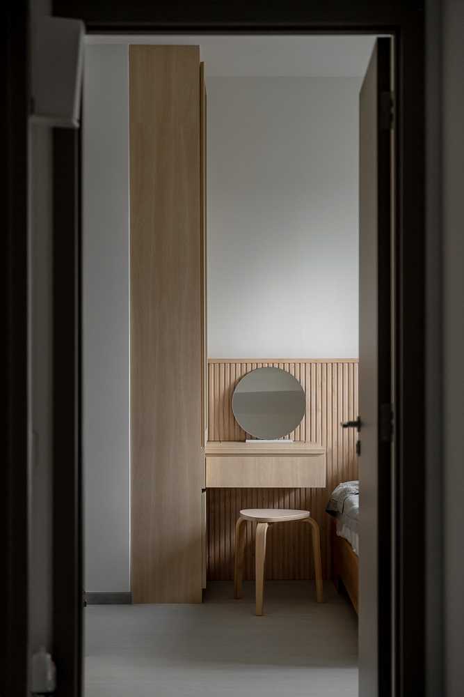 Scandinavian Bedroom with Homogeneous Tiles and Bedside Table
