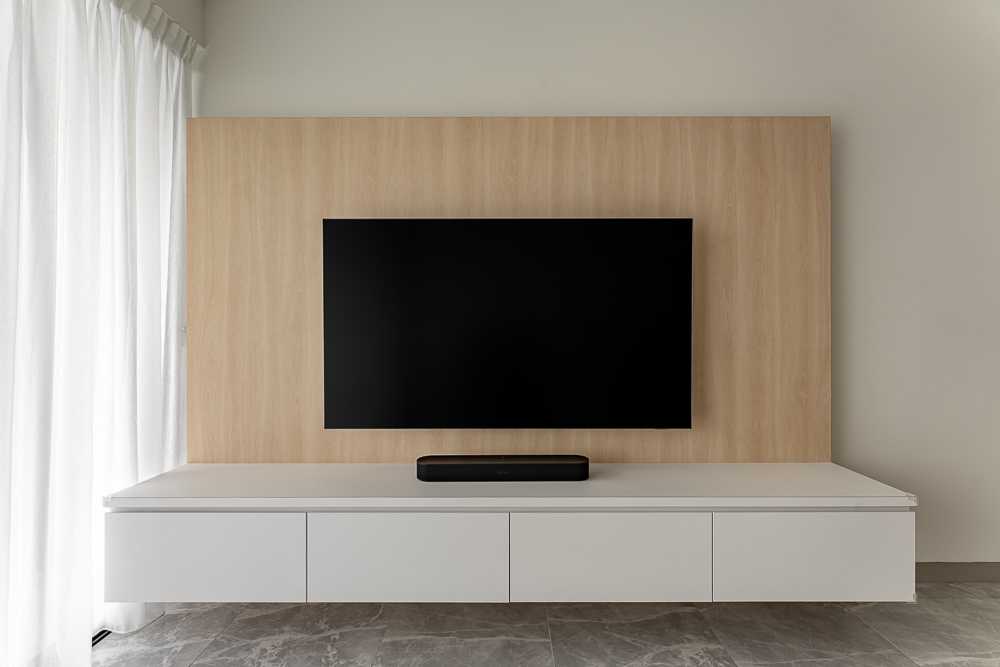 Scandinavian Living Room with Homogeneous Tiles and TV Console
