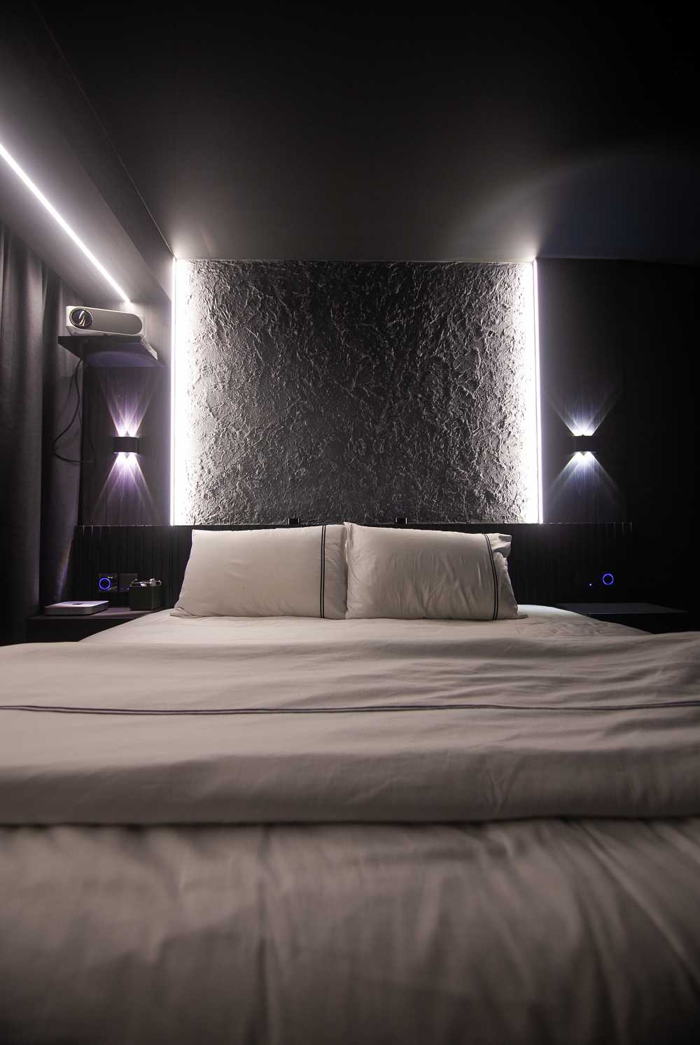 Modern Bedroom with Vinyl Flooring and Feature Wall