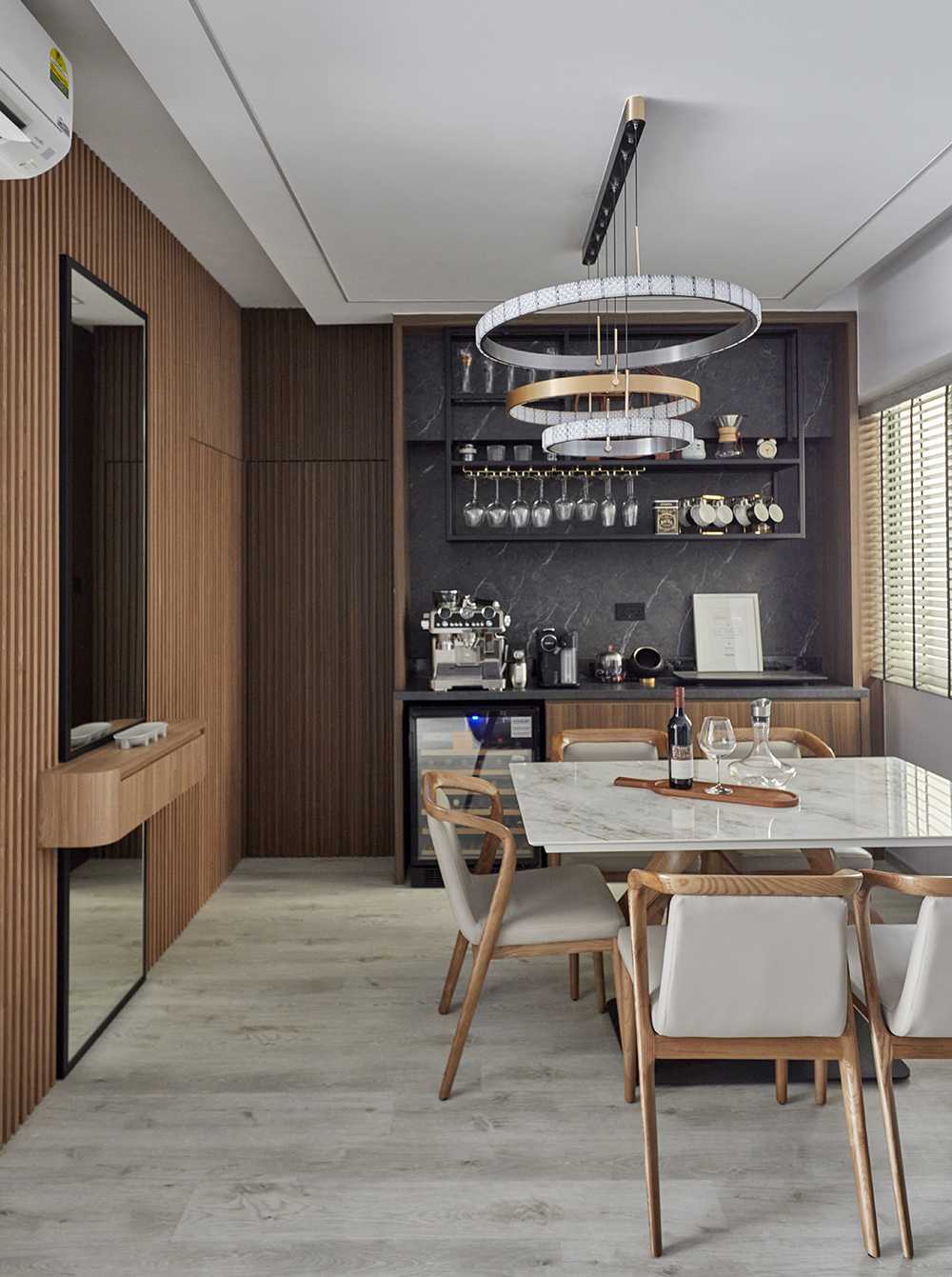 Contemporary Dining Room with Chandelier and Stools
