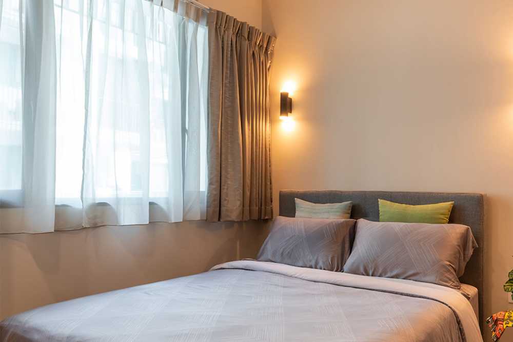Contemporary Bedroom with Bay Window and Queen Bed