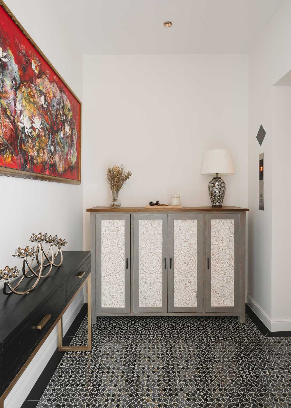 Contemporary Entryway with Artwork and Storage Cabinets