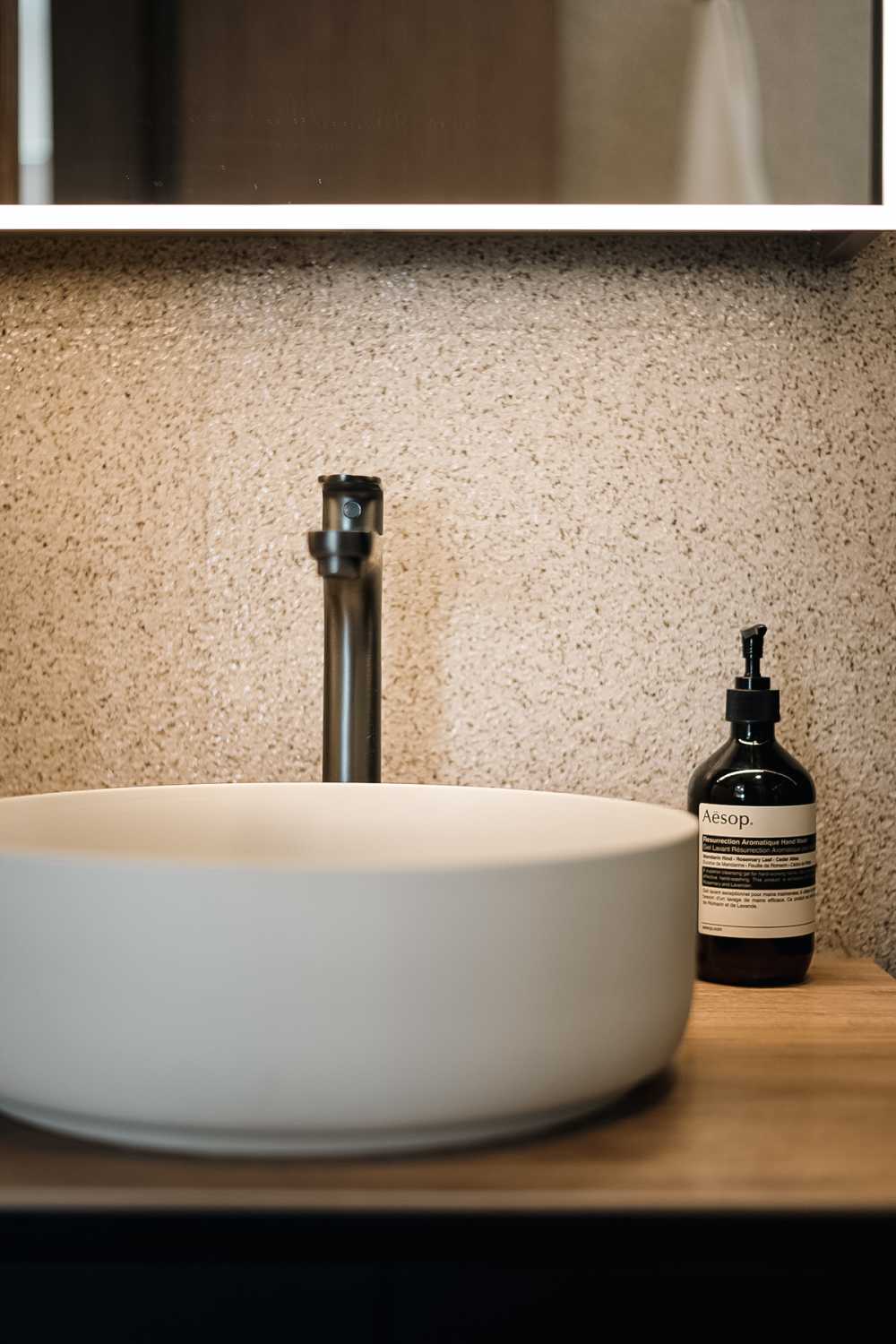 Minimalist Bathroom with Countertop and Mirror