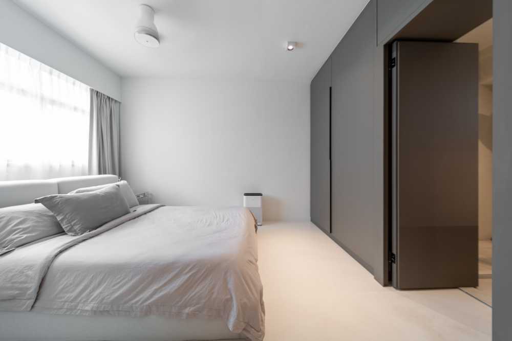Minimalist Bedroom with Cement Floor and Wardrobe