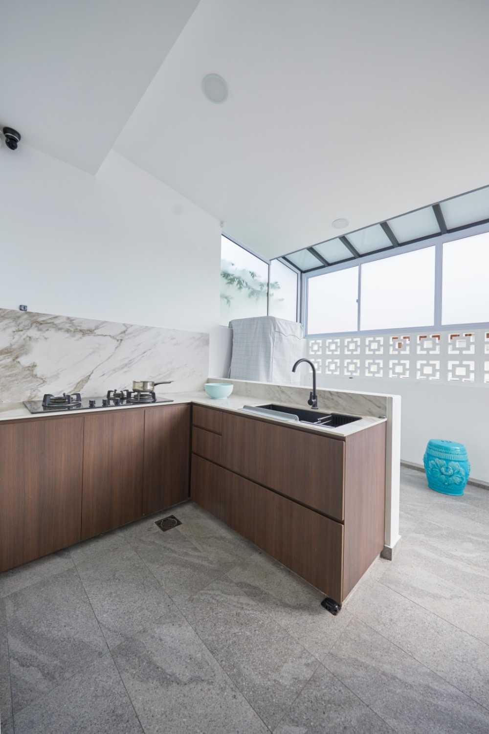 Minimalist Kitchen with Herringbone Tiling and Wood Flooring