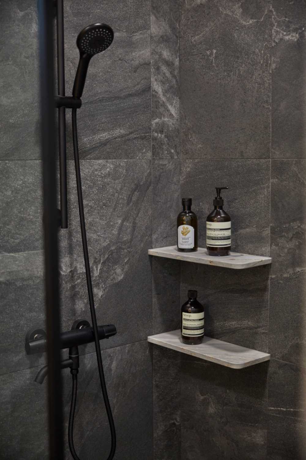 Minimalist Bathroom with Countertop and Herringbone Tiling