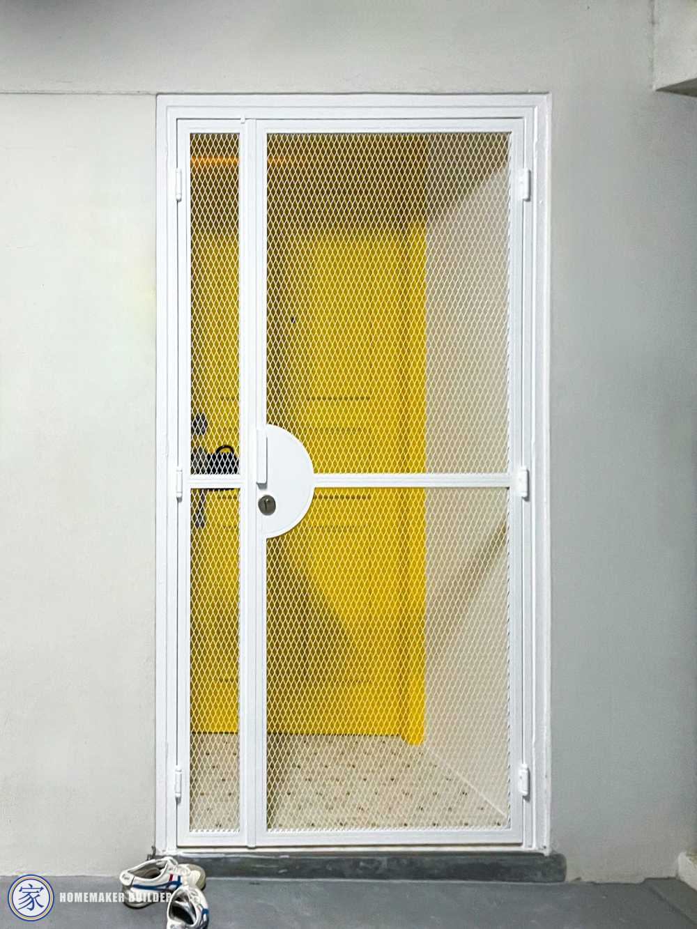 Eclectic Entryway with Metal Gate and Paintings
