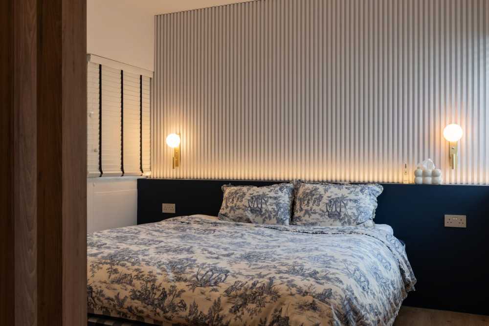 Minimalist Bedroom with Vinyl Flooring and Ceiling Light