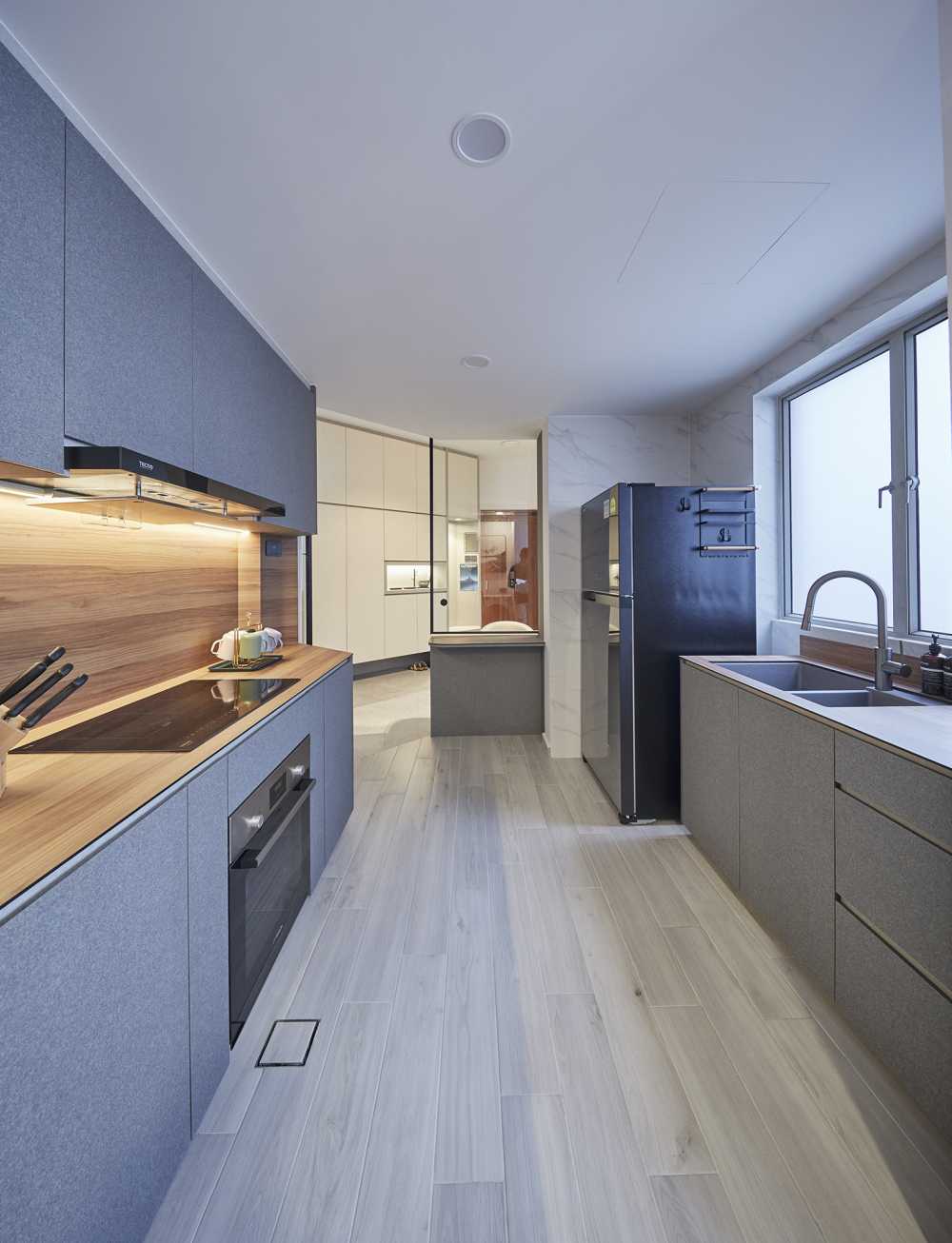 Modern Kitchen with Herringbone Tiling and Cupboard