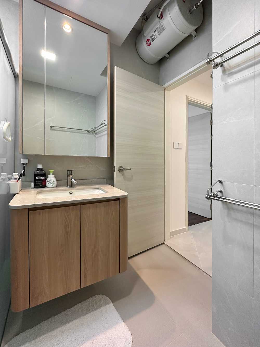 Scandinavian Bathroom with Herringbone Tiling and Wood Flooring