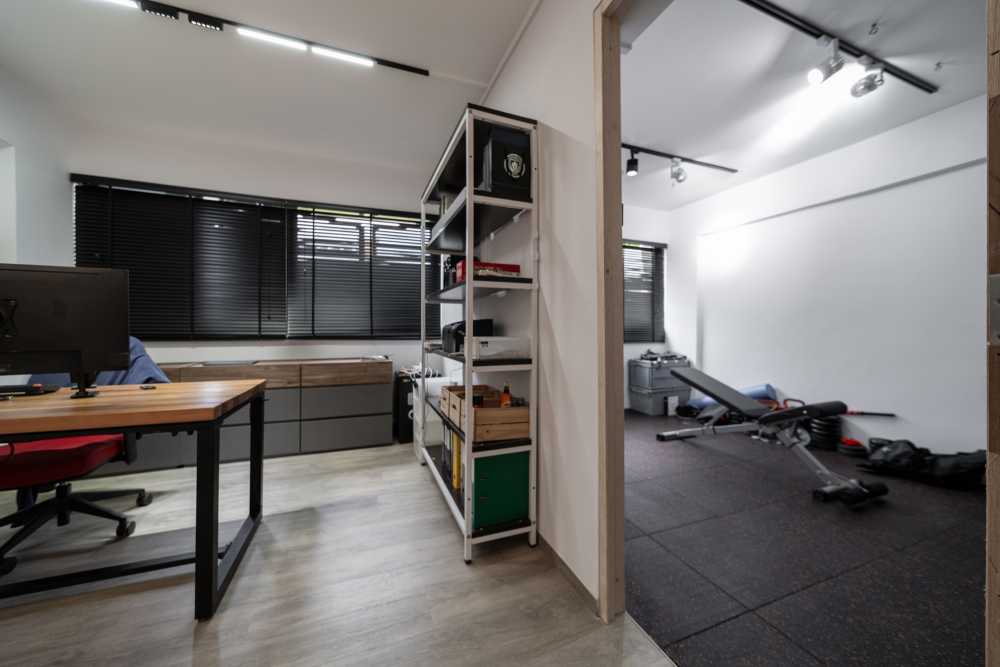 Contemporary Home Gym with Storage Cabinets and Gym Equipment