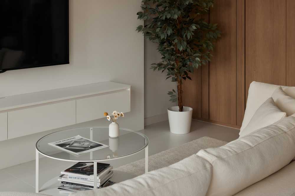 Minimalist Living Room with Homogeneous Tiles and TV Console