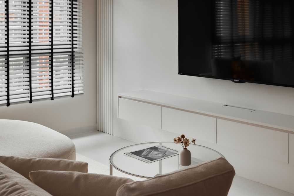 Minimalist Living Room with Homogeneous Tiles and TV Console