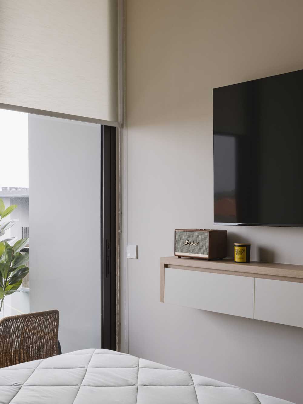 Modern Bedroom with TV Console and Outdoor Chairs