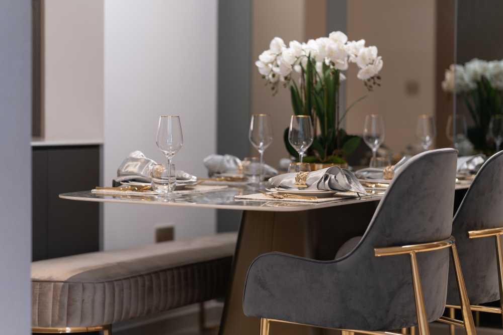 Contemporary Dining Room with Cove Lighting and Drop Ceiling