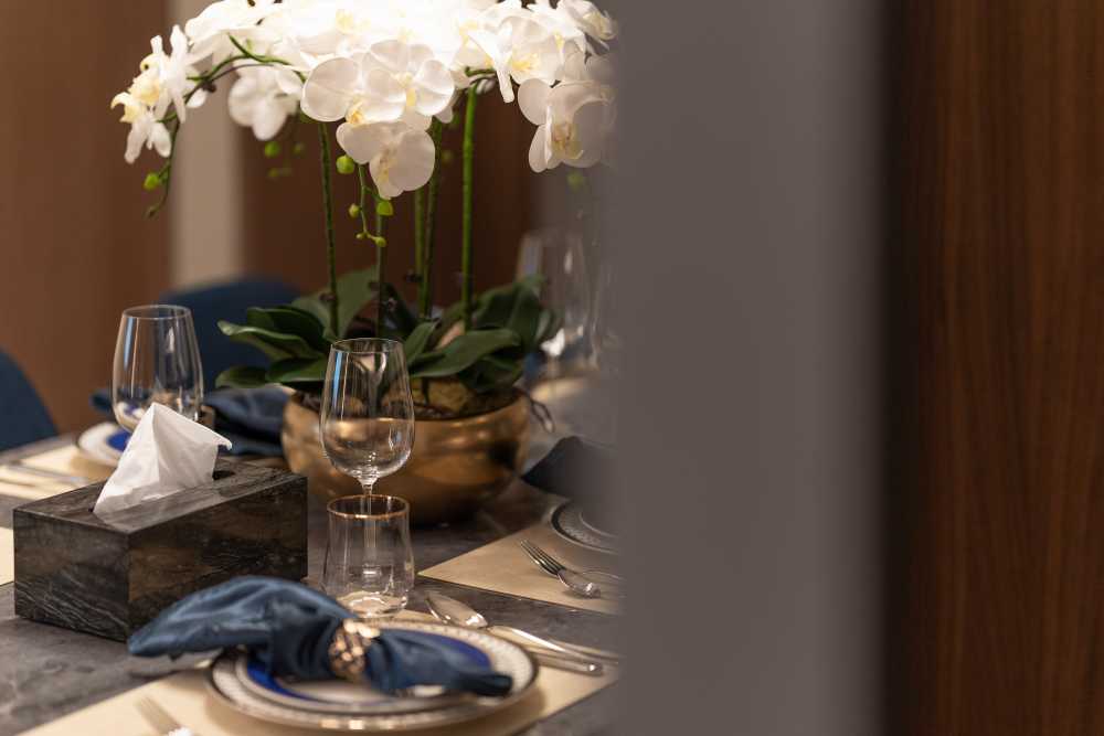 Contemporary Dining Room with Cove Lighting and Drop Ceiling
