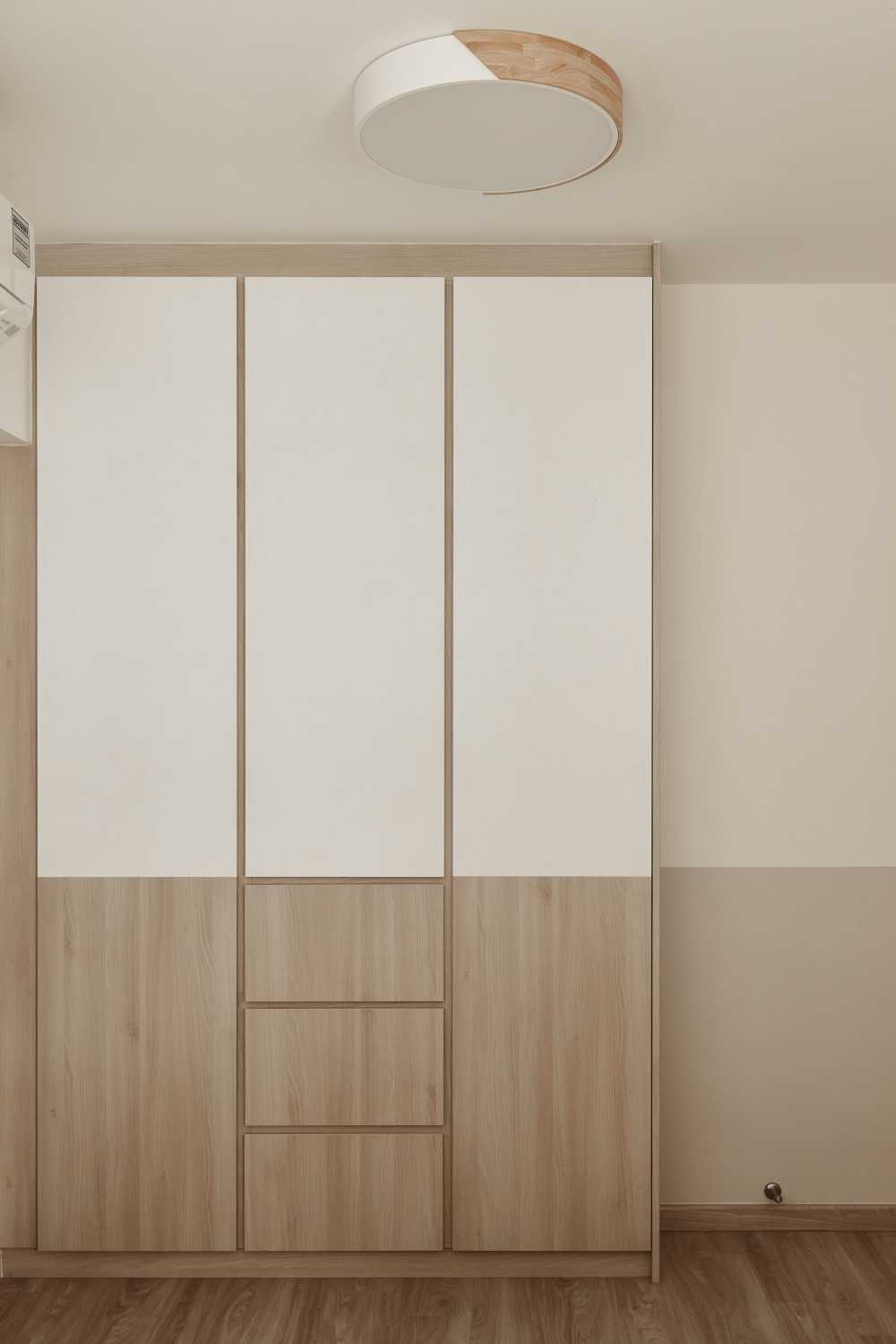 Scandinavian Bedroom with Wood Flooring and Drop Light