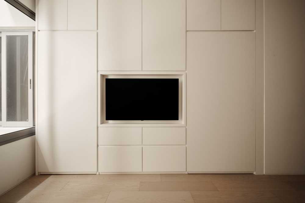 Modern Bedroom with TV Console and Feature Wall