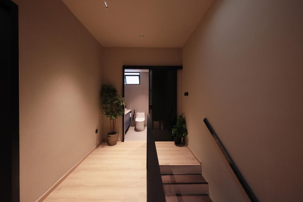 Contemporary Hallway with Bookshelf and Artwork