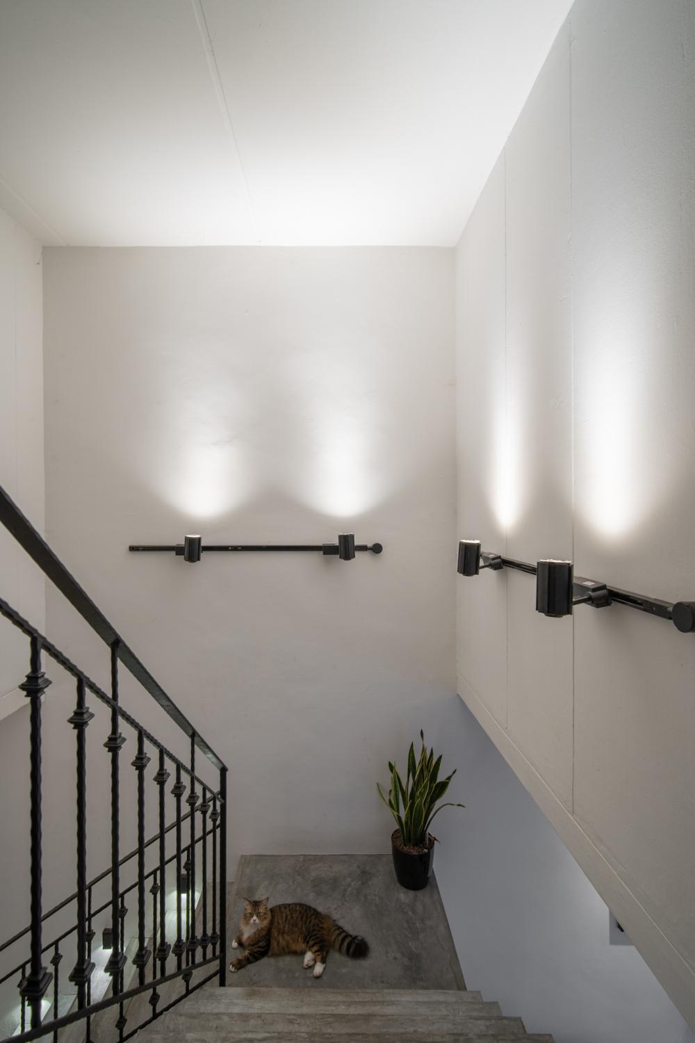 Industrial Living Room with Staircase and Lighting