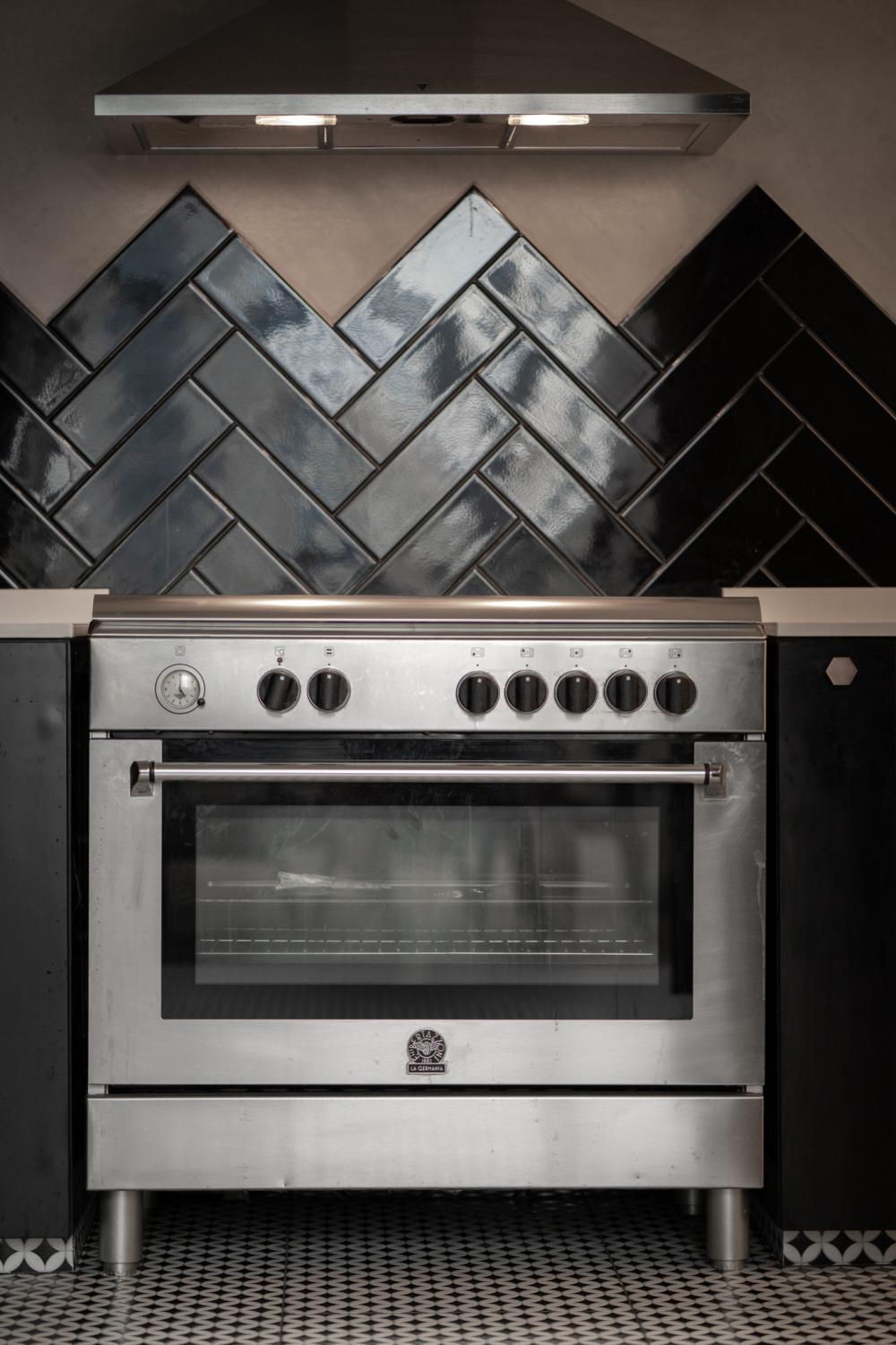 Industrial Kitchen with Kitchen Cabinets and Oven