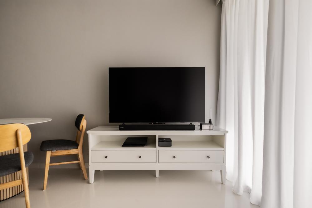 Minimalist Living Room with Homogeneous Tiles and TV Console