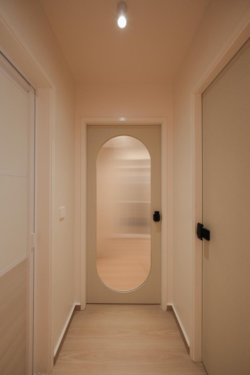 Minimalist Hallway with Bookshelf and Artwork