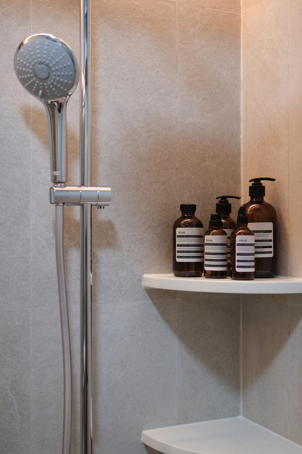 Scandinavian Bathroom with Granite Floor and Wood Flooring