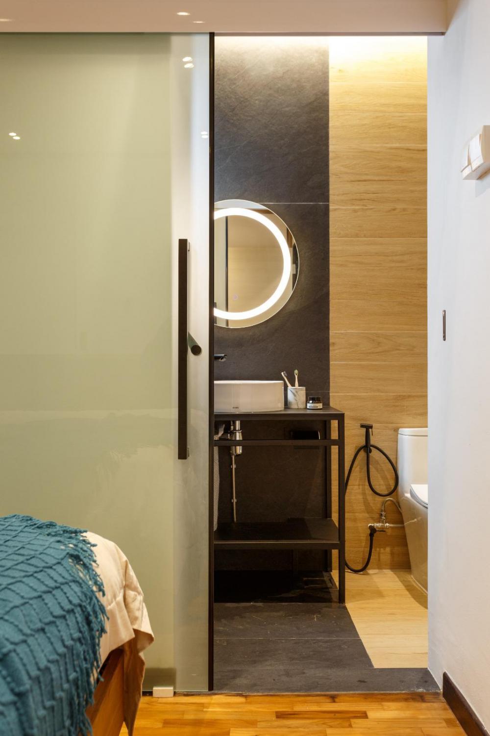 Vintage Bathroom with Wood Flooring and Feature Wall
