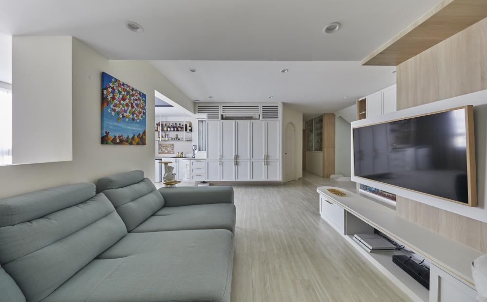 Scandinavian Living Room with Homogeneous Tiles and TV Console