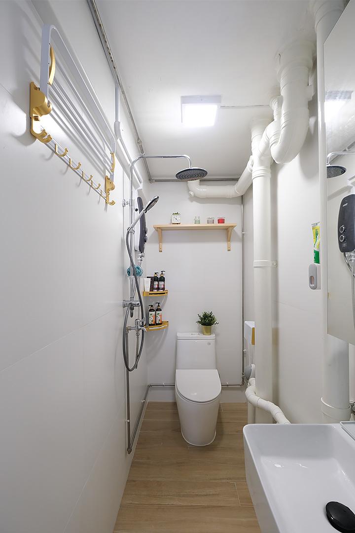 Scandinavian Bathroom with Granite Floor and Shower Screen