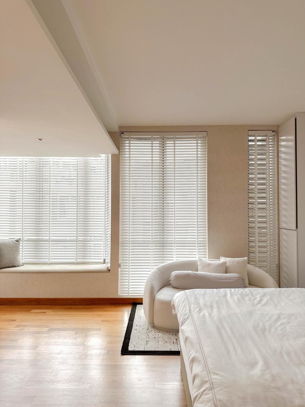Modern Bedroom with Bay Window and Ceiling Light