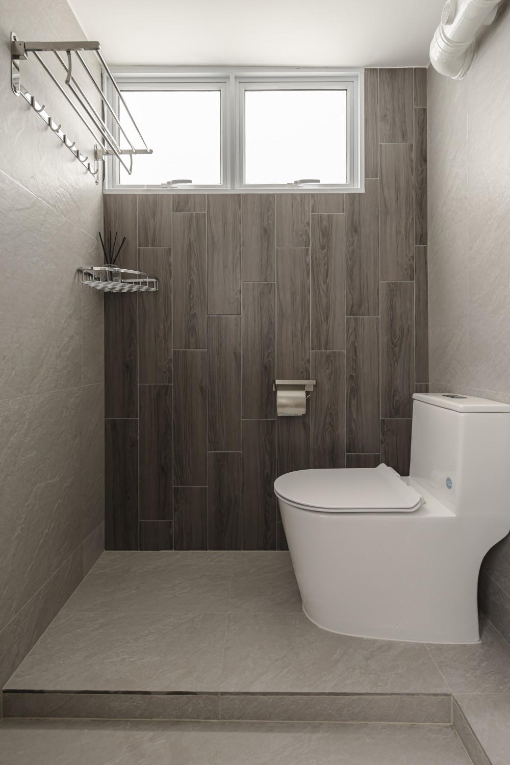 Scandinavian Bathroom with Herringbone Tiling and Drying Racks