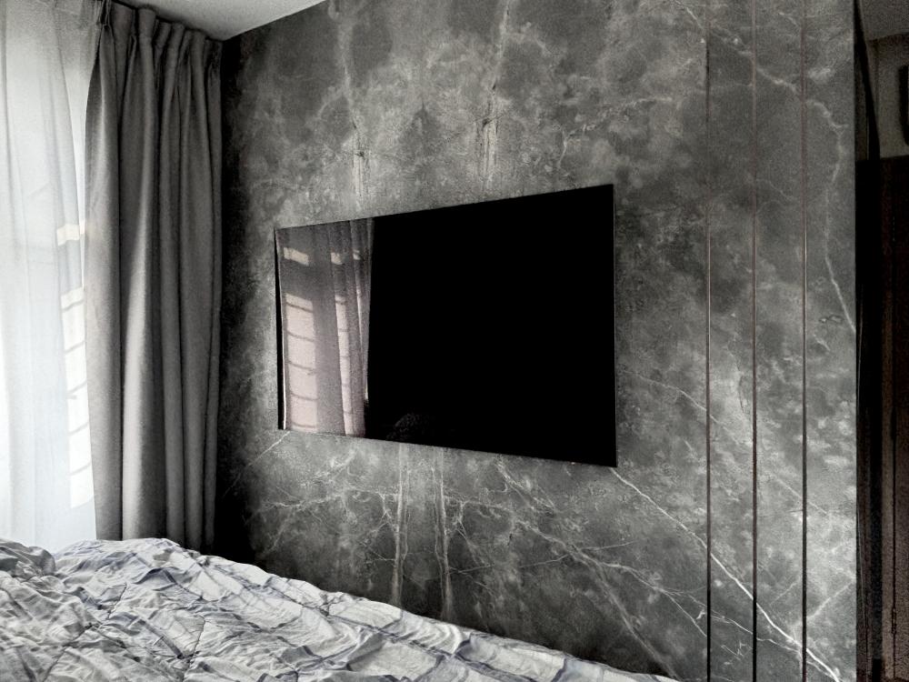 Modern Bedroom with Vinyl Flooring and Feature Wall